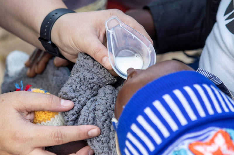 Cup feeding infant with a cleft
